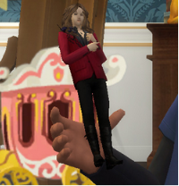 A game recording of a sim wearing a black tshirt with a glowing blue paw on the chest